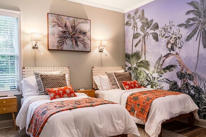 This bedroom offers two twin XL beds for ultimate family comfort!  Ideal for both relaxation and productivity, this bedroom features a dedicated work-from-home space with a desk and chair. 