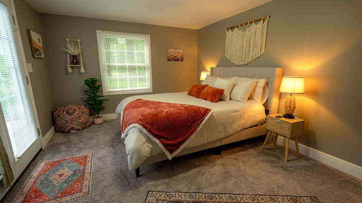 Queen bedroom, TV, electric fireplace, walk in closet, patio access and a side room with built in bunk beds