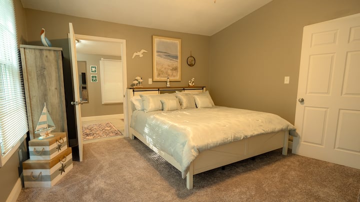 King bedroom, private full bath and closet, private patio with access to hot tub, TV and electric fireplace.