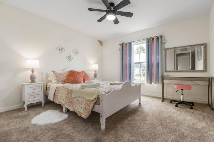 The pink bedroom has that feminine touch.  Use the desk/vanity and mirror for getting ready to go out!  The comfy queen size bed is perfect for any guest(s)!
