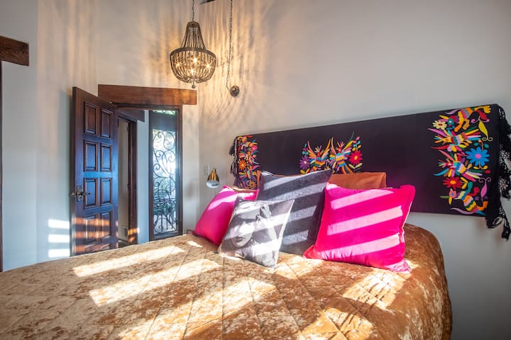 Cozy Bedroom upstairs with queen bed and custom art work