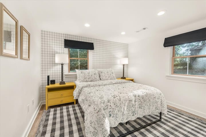 Bedroom 3: Queen-size bed with luxury linens and pillows.