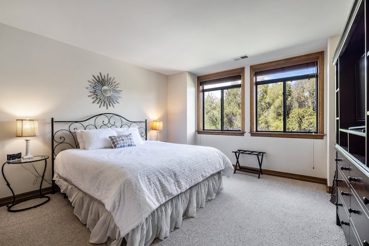 Another large bedroom overlooking the river, with a TV, large closet and full bathroom just steps away. 