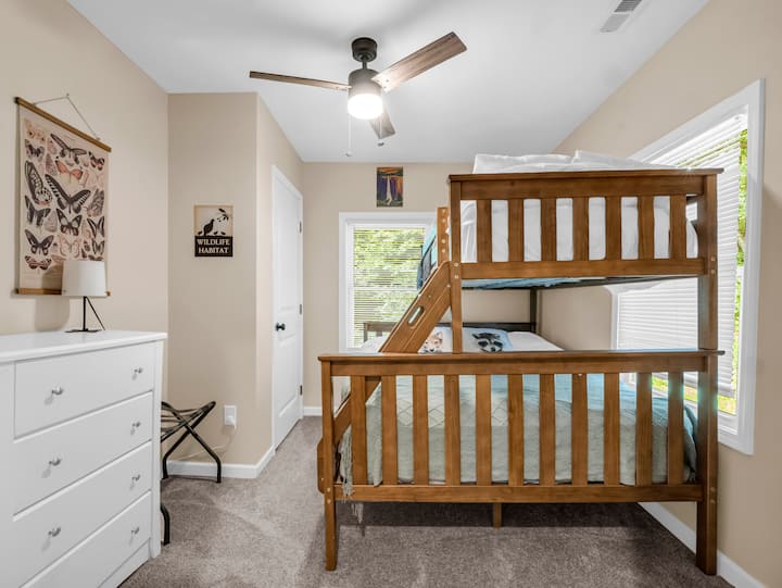This cozy bedroom is perfect for both adults and children, offering comfort and flexibility for the whole family. Stocked with kids' games and books, it's a perfect space for little ones to play, read, and let their imaginations run wild! 