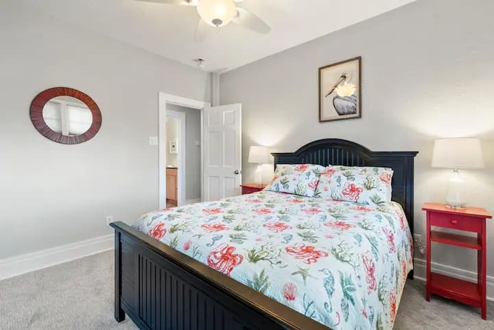 Queen bedroom with tv and full size dresser drawers. Room for a pack and play (stored in the closet) or crib to be set up/added when needed. 