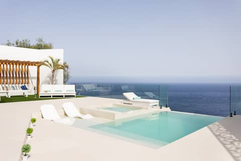 Luxury beachfront, heated pool, and car