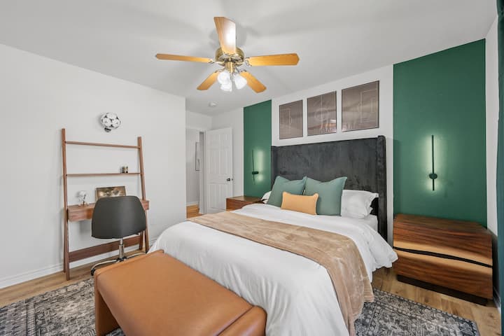 This bedroom includes a dedicated workspace, perfect for those needing to catch up on work or enjoy some quiet study time.