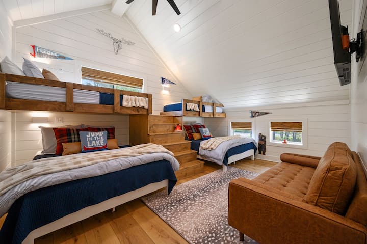 Bunkroom (Bedroom #3) has 2 queen beds and 2 twin bunk beds.  Includes a 50 inch Roku TV above a 60 inch loveseat. 