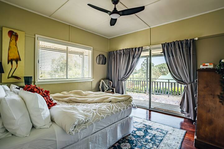 The ‘Cedar Rooms' sliding doors (which are old and sometimes stick), opens onto a wide verandah, where a comfortable outdoor lounge invites you to soak up the northern and western sun.