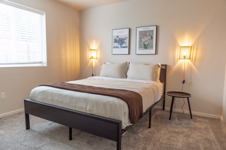 This room hosts a comfortable queen-size bed, with crisp linens. Blackout blinds ensure a peaceful night's sleep and dimmable sconces, extra set of bed sheets in the closet.