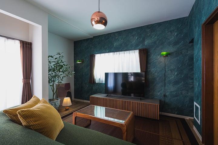 3-seater sofa, 50-inch smart TV.