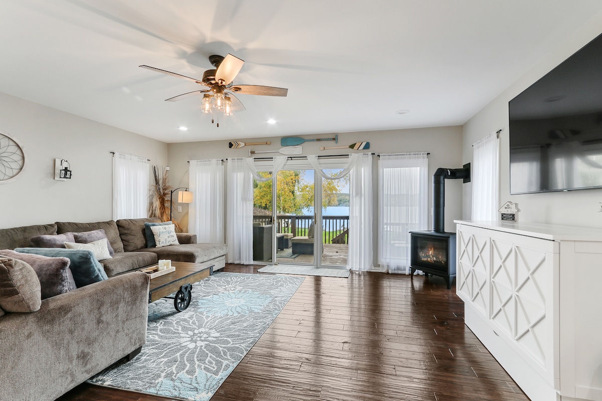 Cozy up with the fireplace in the living room overlooking Lake Como.