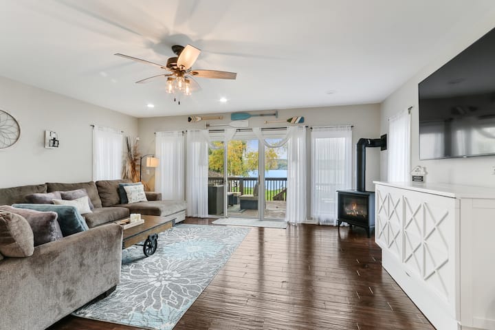 Cozy up with the fireplace in the living room overlooking Lake Como.