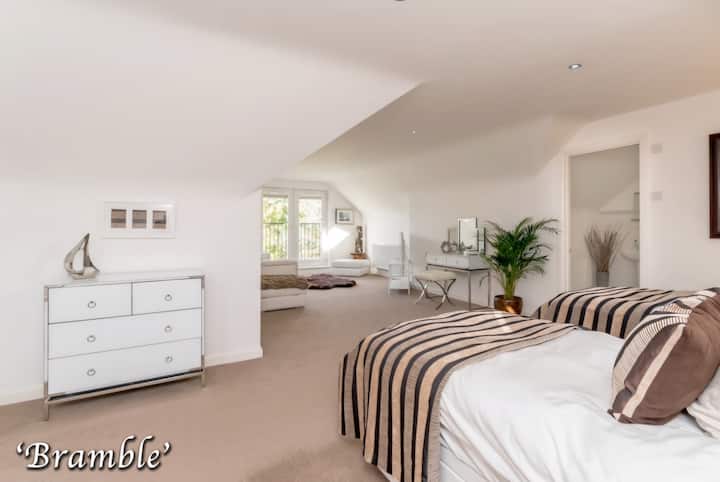 Luxurious bedroom suite with Superkingsize bed (which can be slit into 2 singles if required), ensuite bathroom and relaxing seating area with beautiful viewd over grounds and loch 