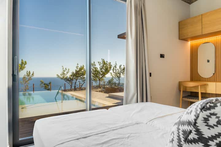 בחדר השינה הזה יש 2 מיטות זוגיות, שניתן ליצור יחד כדי ליצור קווין על פי בקשה