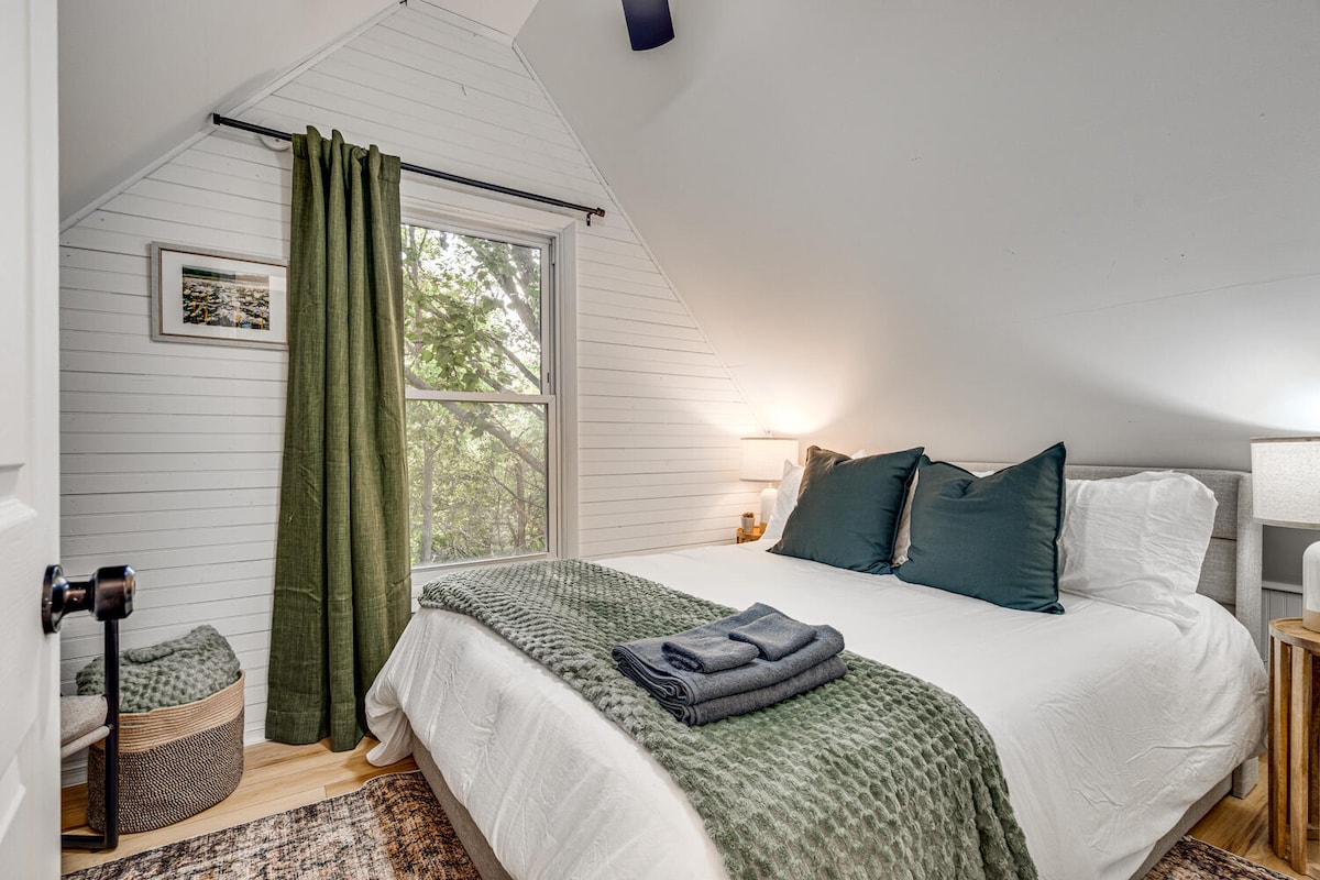 Bedroom Retreat: Plush pillows and warm lighting create the ultimate relaxation spot!