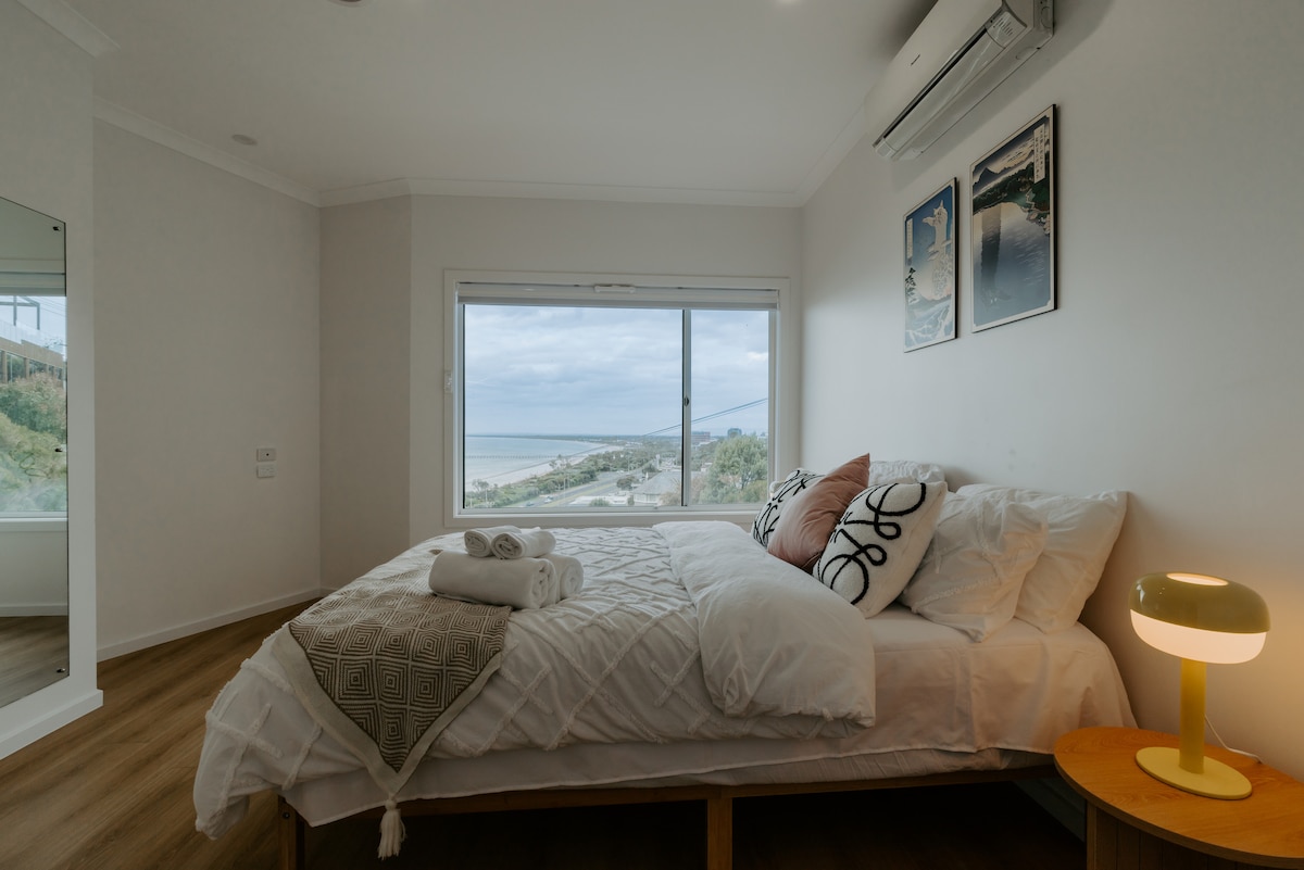 Wake up to a breathtaking bay view right from the comfort of your bed.