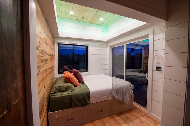 This third bedroom is large featuring recessed LED ceiling lighting and a sliding glass door to your large private balcony.