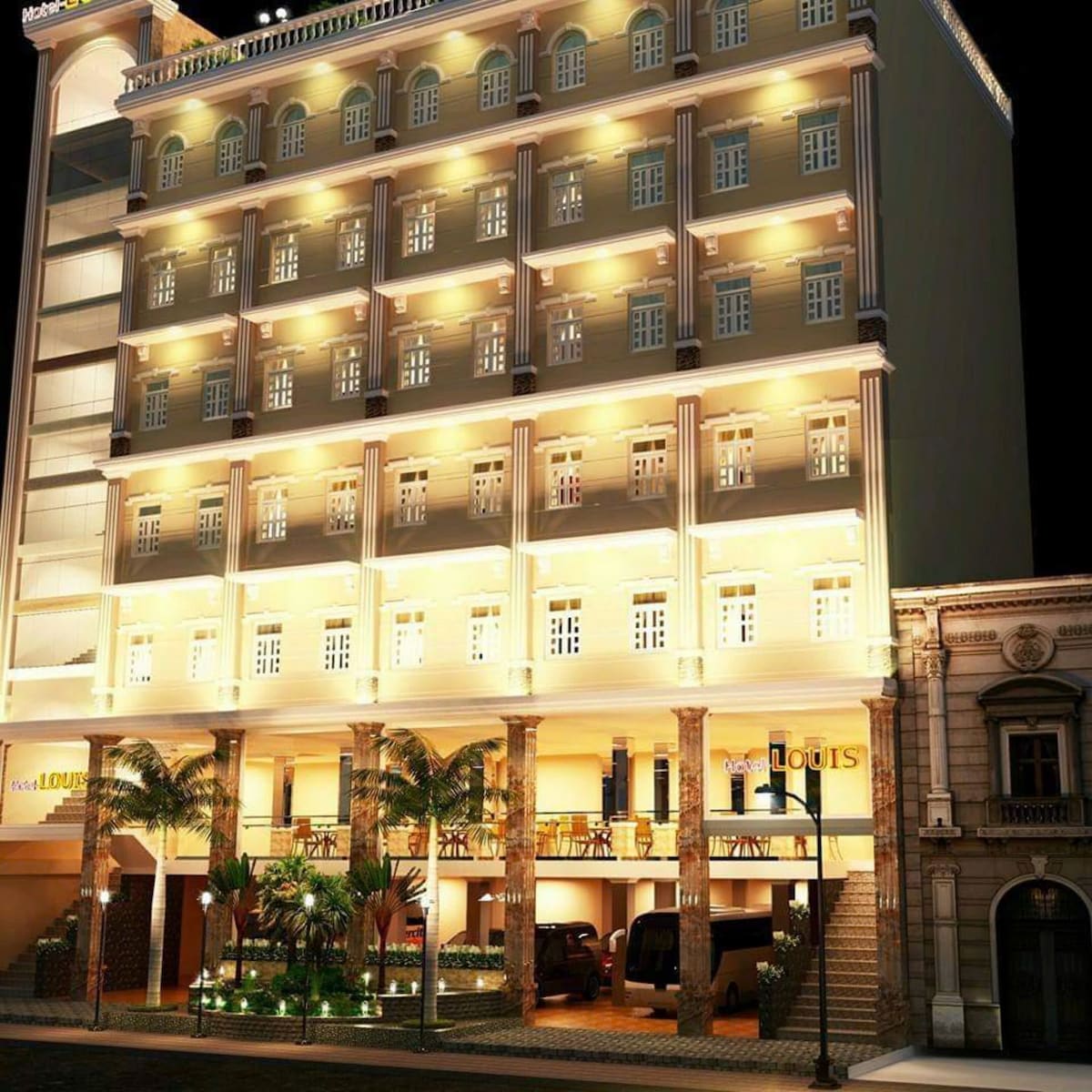 The exterior of a stylish hotel is illuminated at night, showcasing a symmetrical facade with multiple rows of windows framed in light. Palm trees are visible near the entrance, enhancing the welcoming atmosphere of the building.