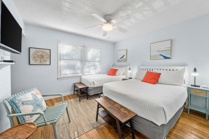 Second Bedroom with a comfy full size and twin bed. Benches at the foot of the beds for extra storage. Each sleeper has access to a bedside table.