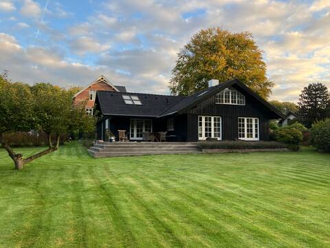Luxurious wood house by forest and lake