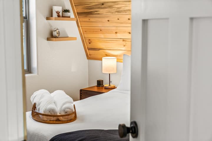 The main-level bedroom is conveniently located across from the kitchen