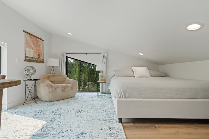 Bedroom 3 is an open loft accessed by the spiral staircase in the living room.  It has a king sized bed.