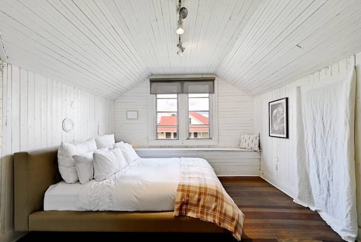 This is upstairs in an open floor plan large space with an additional "nook" with two twin beds, a bathroom, a desk, and a mini kitchen set up!