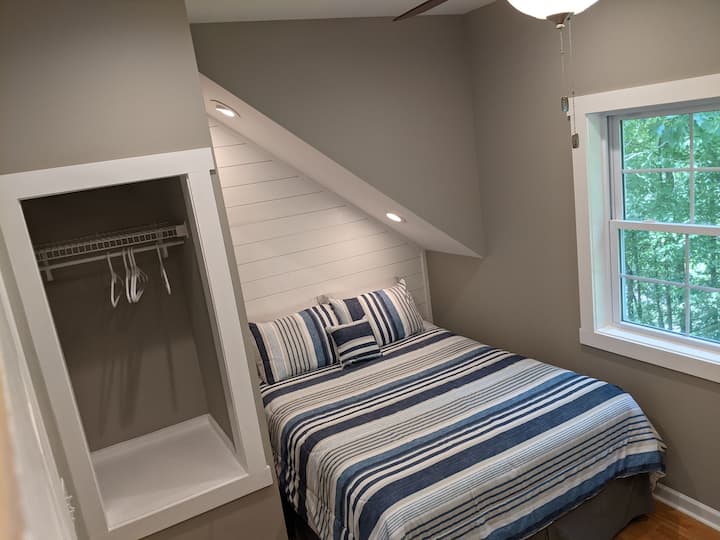 Queen bedroom in space over garage (MIL Suite).   This is the quietest room in the house because it's the farthest away from the dock and the kids rooms. 