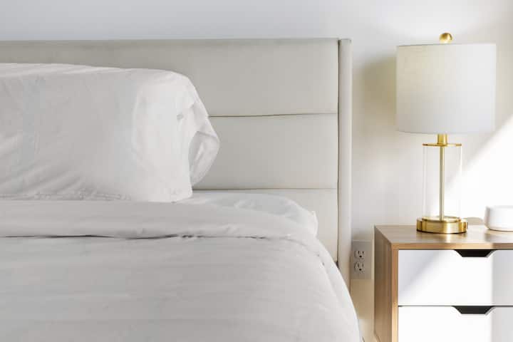 Modern comfort meets minimalist design in our tranquil bedroom space, complete with hotel-quality linens and contemporary accents.