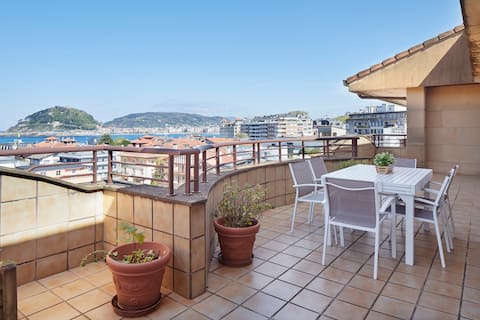 On the beach, with a terrace and parking