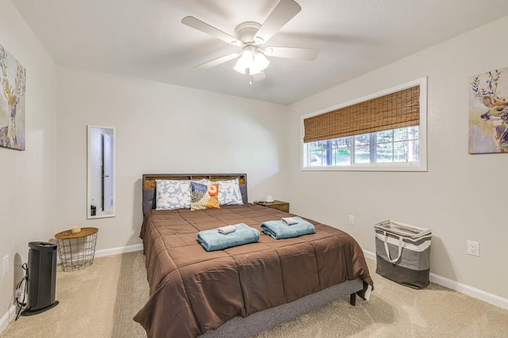 Relax in queen bedroom with blackout shades for deep rest