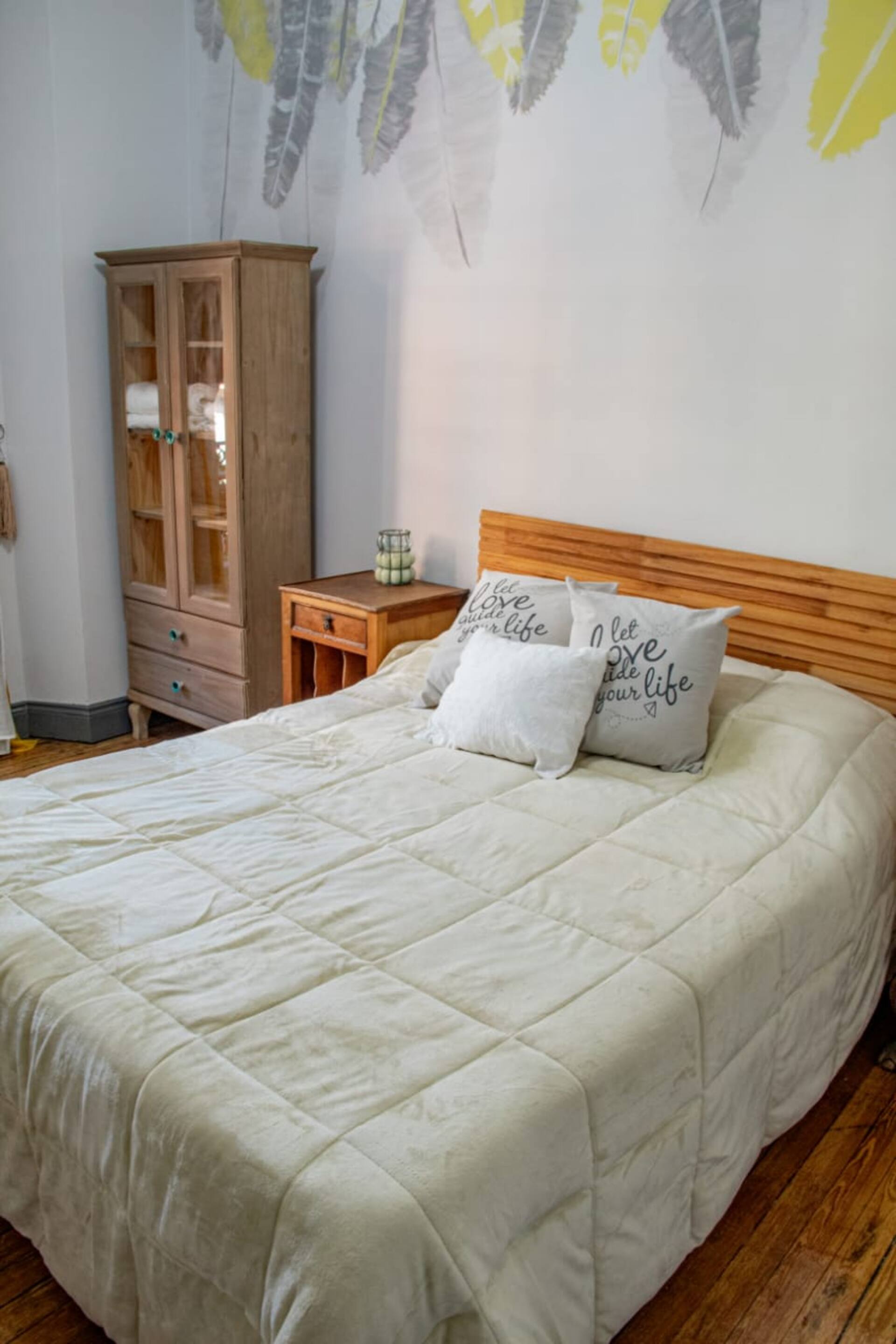 A room with a double bed and a full private bathroom