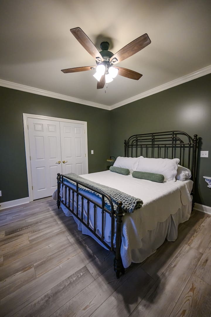 King-sized bed, closet space, shared main-floor restroom, and an amazing view of the west side of the property.
