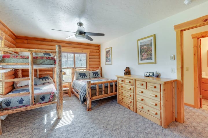 A multi-bedroom layout that includes a full bed, a twin bunk bed, and a queen Murphy bed, offering flexible sleeping arrangements for guests