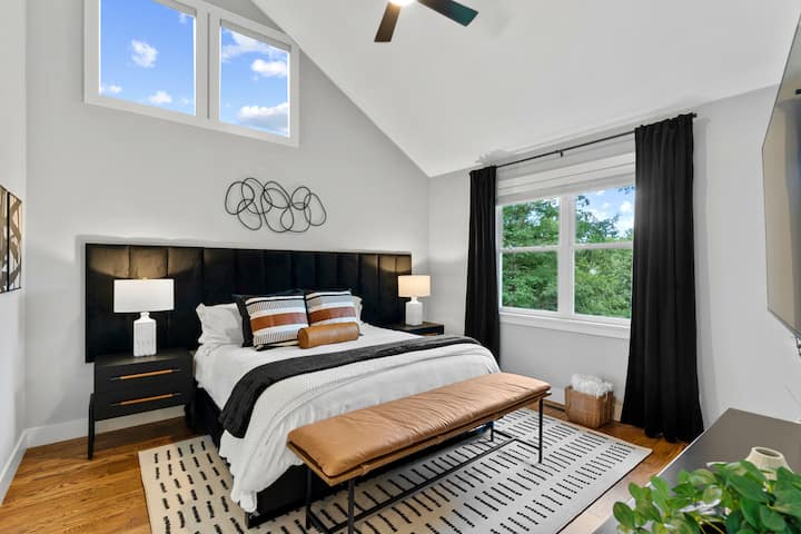 Our master bedroom is designed for both comfort and style, featuring a plush king bed, stylish decor, and abundant natural light.