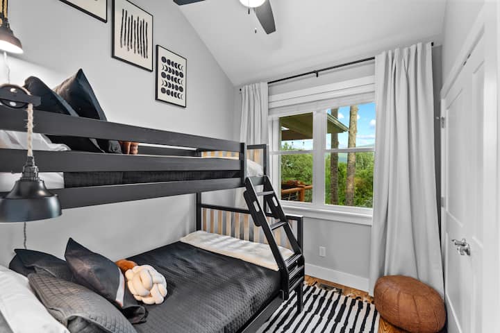 Fun and functional bunk beds make this bedroom perfect for kids or groups. 