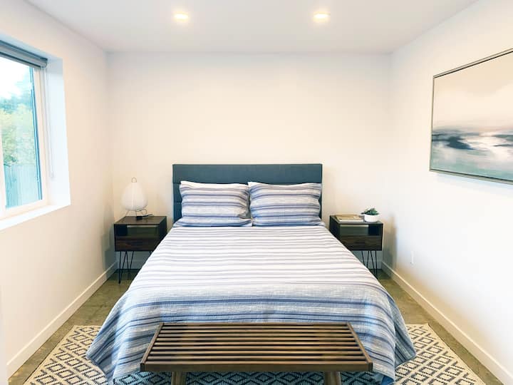 Bedroom 1 features a queen-size original Tuft & Needle foam mattress (medium-firm feel), and an array of pillow options (down alternative, memory foam, cool & hot sleeper) for a comfortable night’s sleep. 

