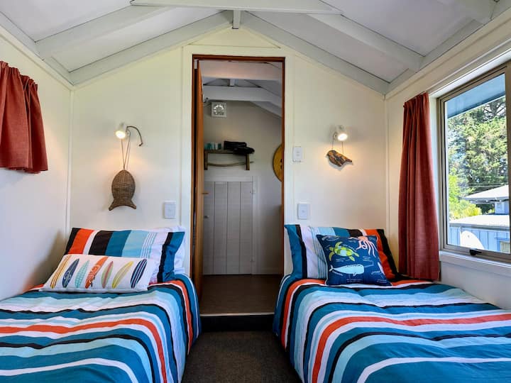 Two single beds upstairs with spare throws and hotwater bottles available. Ensuite with shower, handbasin & toilet. Bath towels, beach towels, bath mat, hand towel & face cloths supplied.