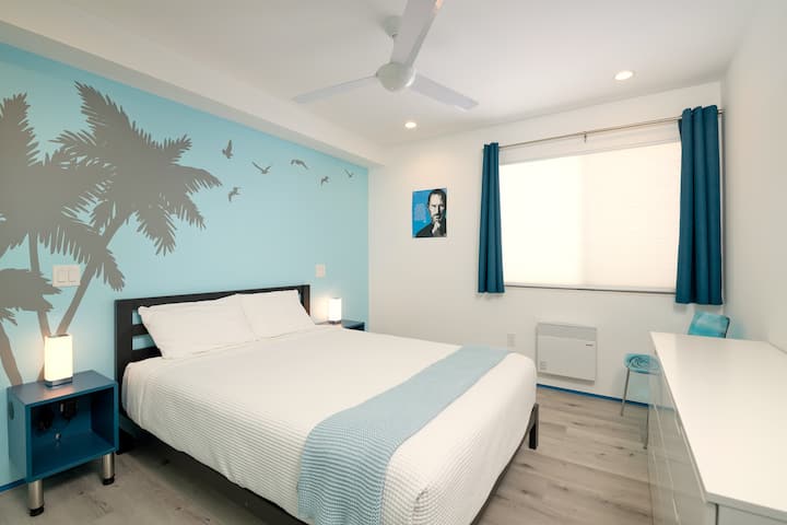 The secondary bedroom is more playful in style and features a comfortable Queen-sized bed. Lights and ceiling fan can be controlled from either side of the bed. The nightstands have built-in USB ports to charge your devices.