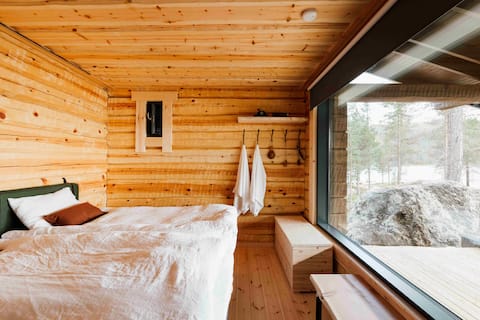 Traditionally crafted log cabin by the lake Inari