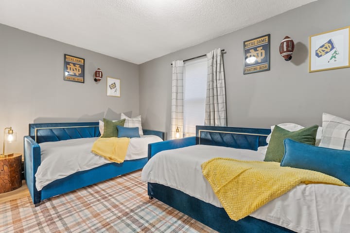 Bedroom 2 is equipped with two trundle beds, offering flexible sleeping arrangements and maximizing space.