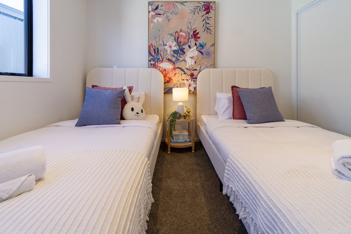 This room features two single beds, each with comfortable mattresses and crisp linens.
