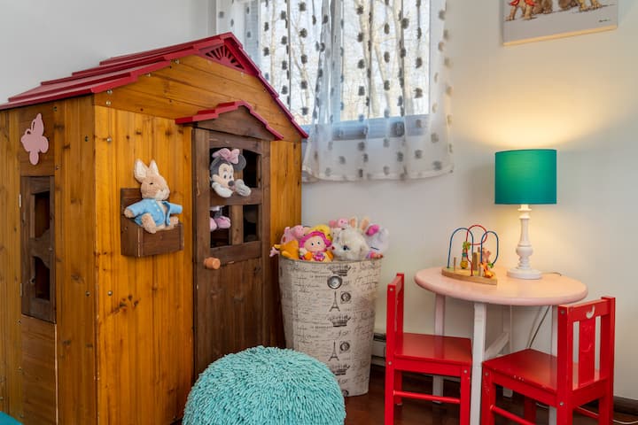 Another point of view from the upstairs bedroom includes the playhouse, kids' table, and chairs