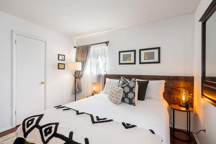 This first-floor bedroom features a spacious closet and air conditioning for added comfort. It is furnished with a cozy queen bed, perfect for relaxation and a restful night’s sleep.