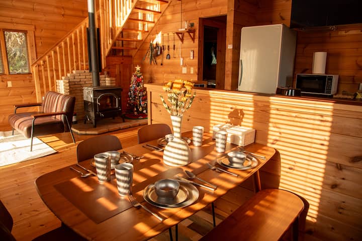 Log house | Mt. Tokachi view | Near Tomita Farm, Furano Ski Resort, and 650 meters from Naka-Furano…