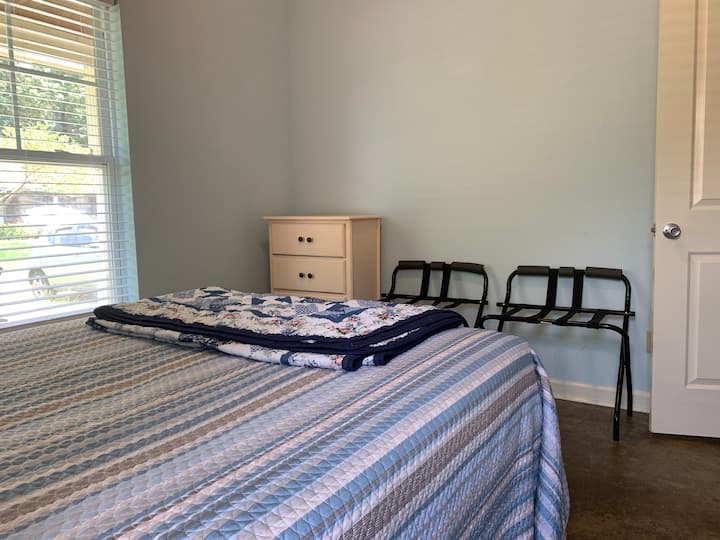 Bedroom 2 offers luggage rack, dresser, closet for storage/space, and ceiling fan.