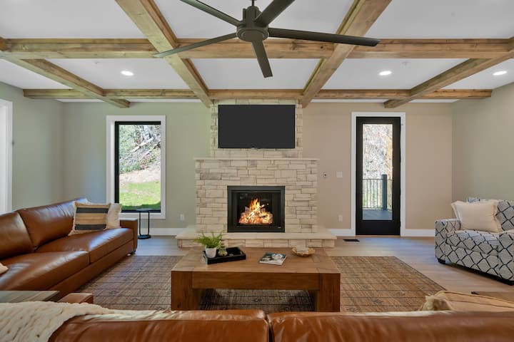 Gather around the stone fireplace in the living room for cozy evenings, perfect for unwinding after exploring Gatlinburg attractions.