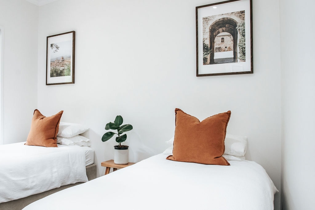 Twin bedroom with single beds and built in wardrobe