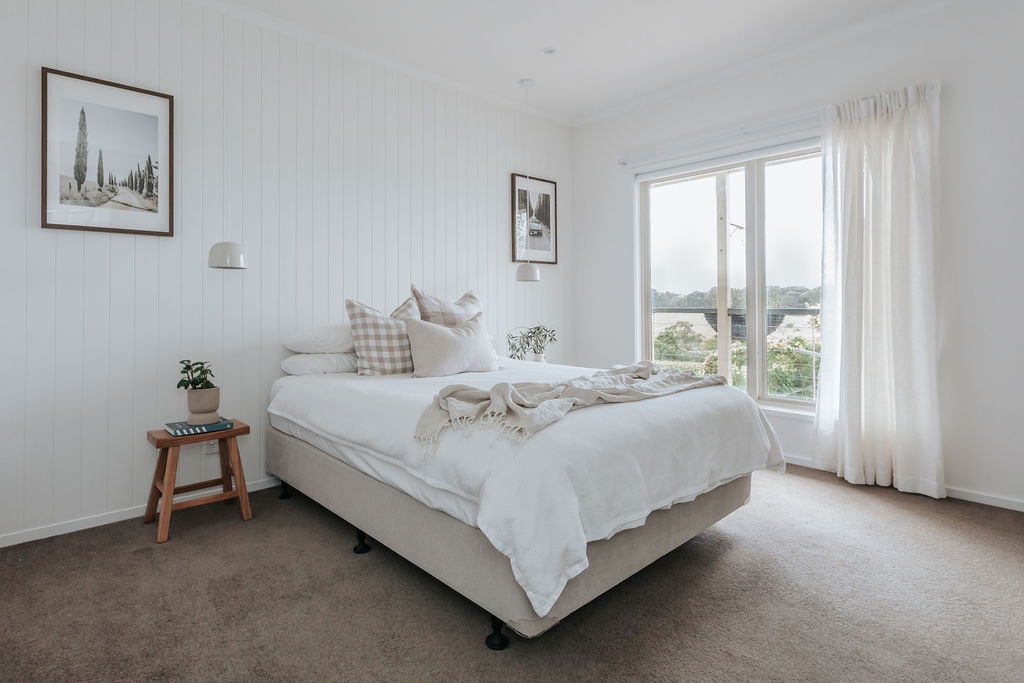 Master bedroom overlooking the terrace and vineyard, with ensuite bathroom and walk in robe